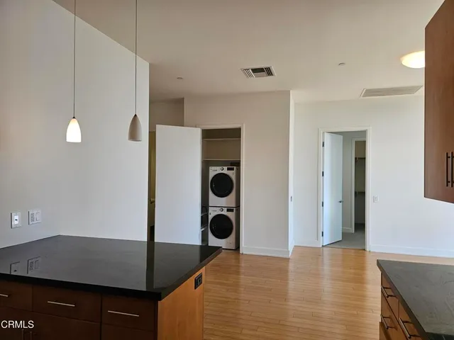 a view of kitchen island with furniture and wooden floor