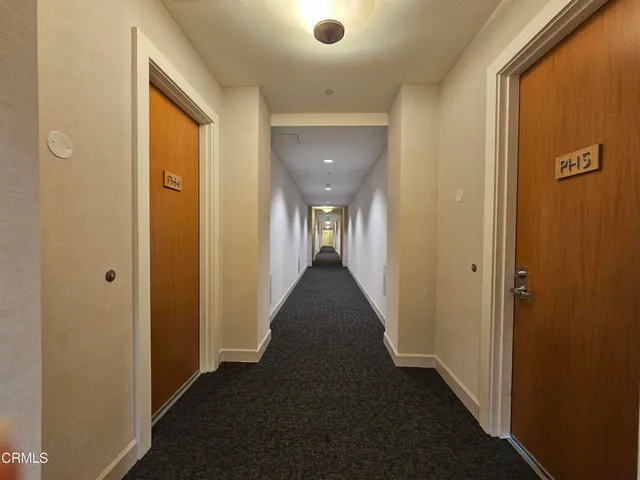 a view of a hallway with a door