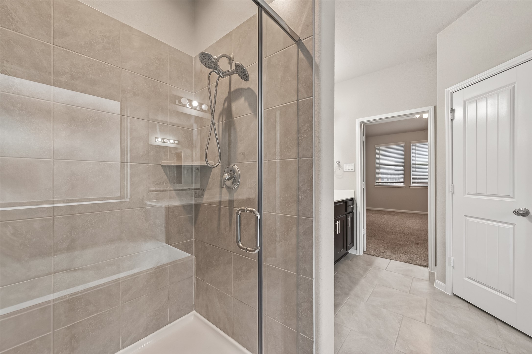 219 Verde Lake Way Rosenberg, TX 77469 - Photo 17 of 19 a bathroom with a bathtub and a shower