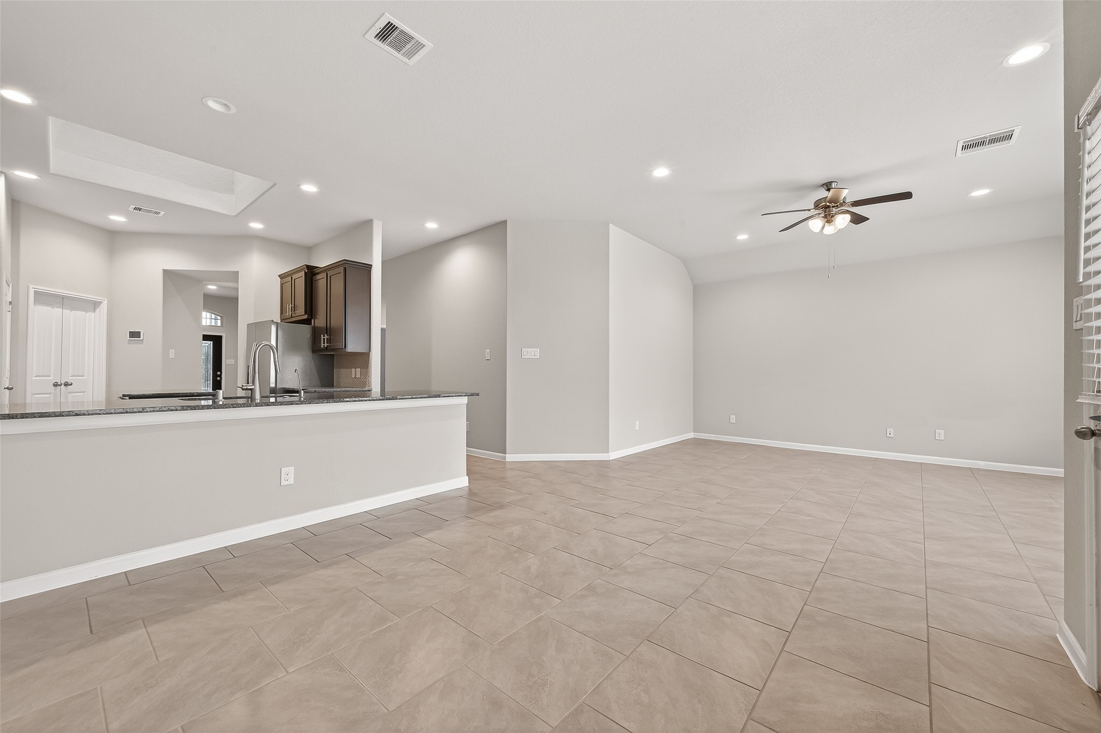 219 Verde Lake Way Rosenberg, TX 77469 - Photo 8 of 19 a view of a kitchen with sink and a ceiling fan