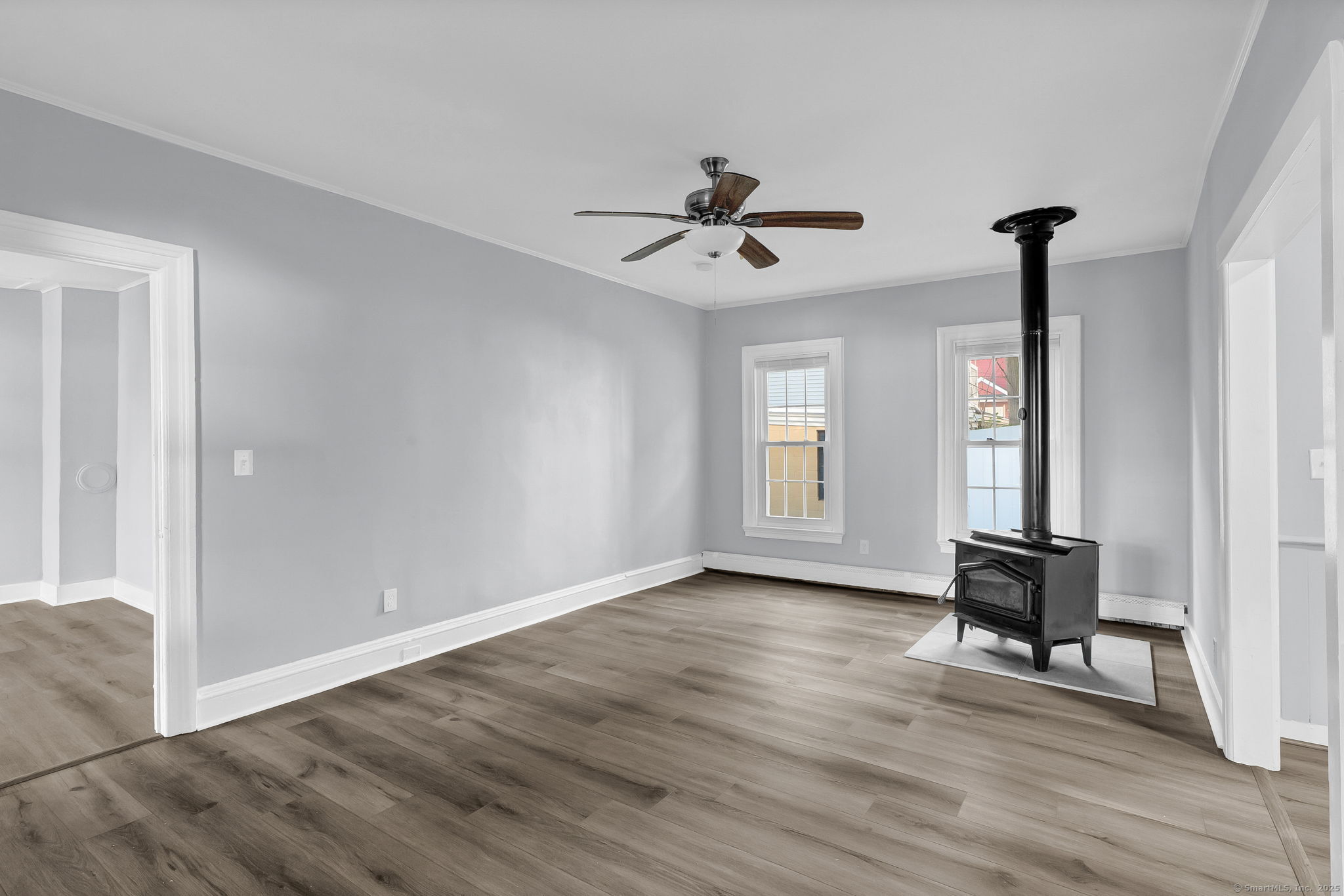 89 Spring Street Windham, CT 06226 - Photo 18 of 36 a view of room with hardwood floor and ceiling fan