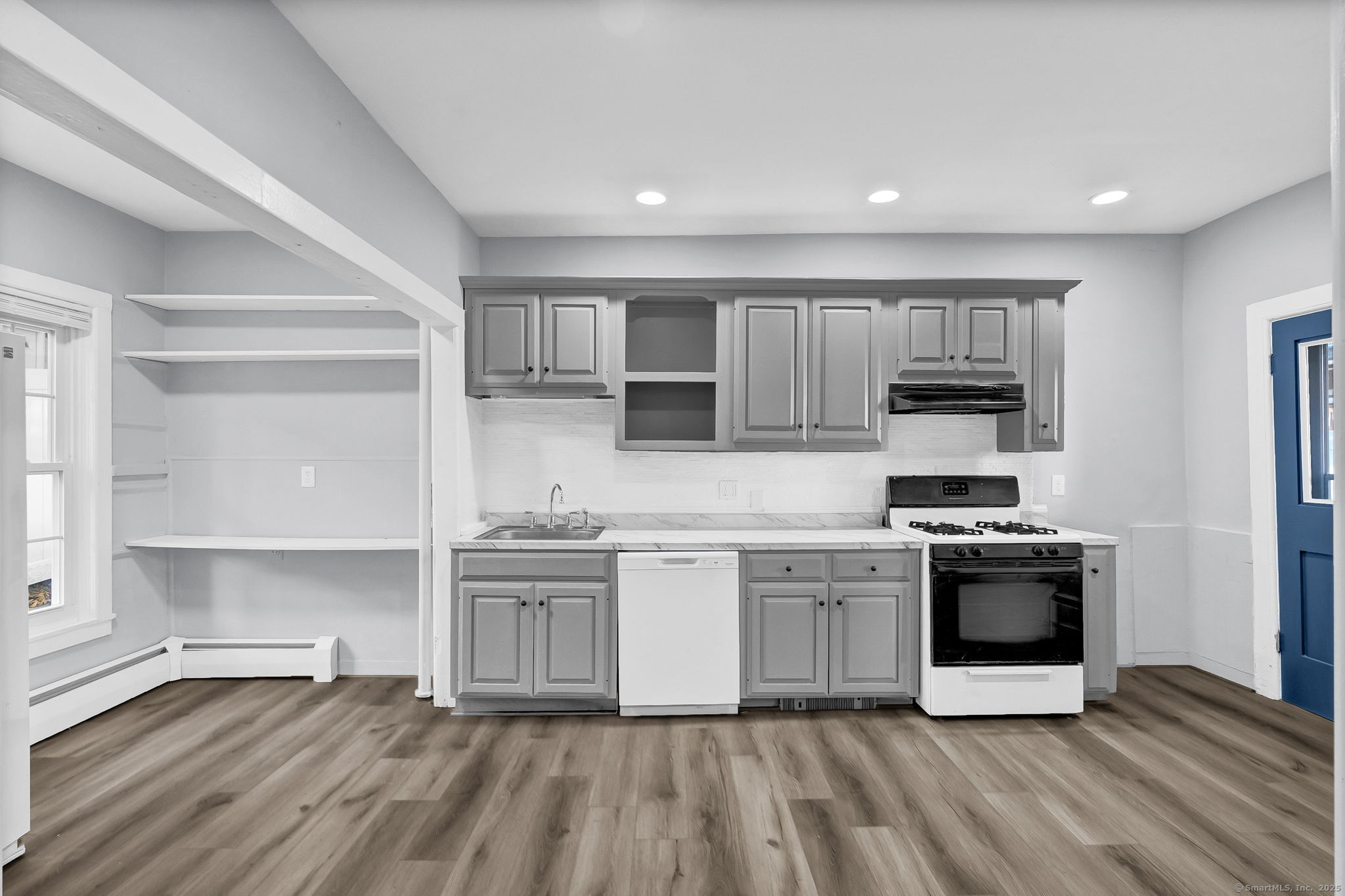 89 Spring Street Windham, CT 06226 - Photo 20 of 36 a kitchen with stainless steel appliances granite countertop a stove and a sink