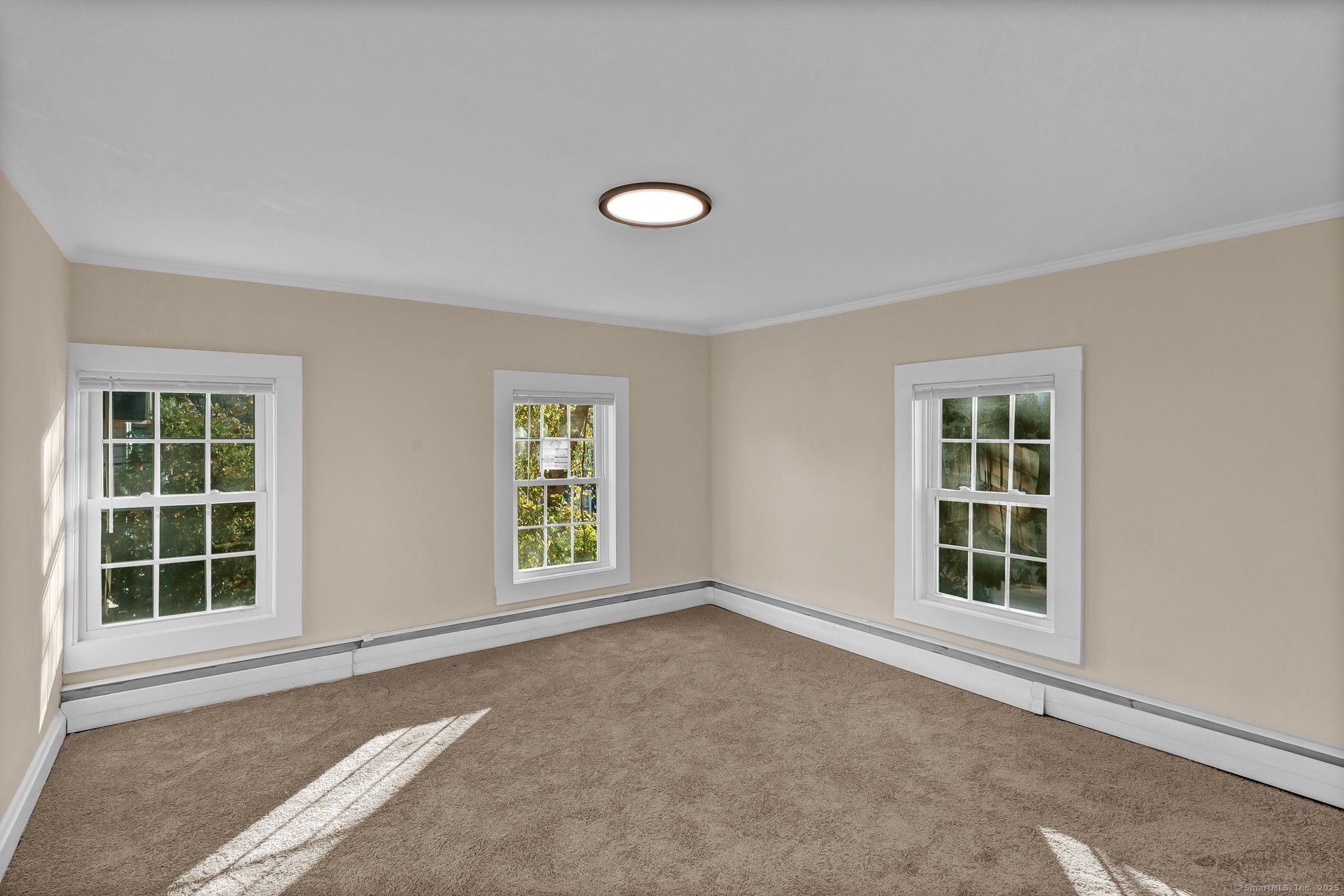 89 Spring Street Windham, CT 06226 - Photo 25 of 36 an empty room with windows