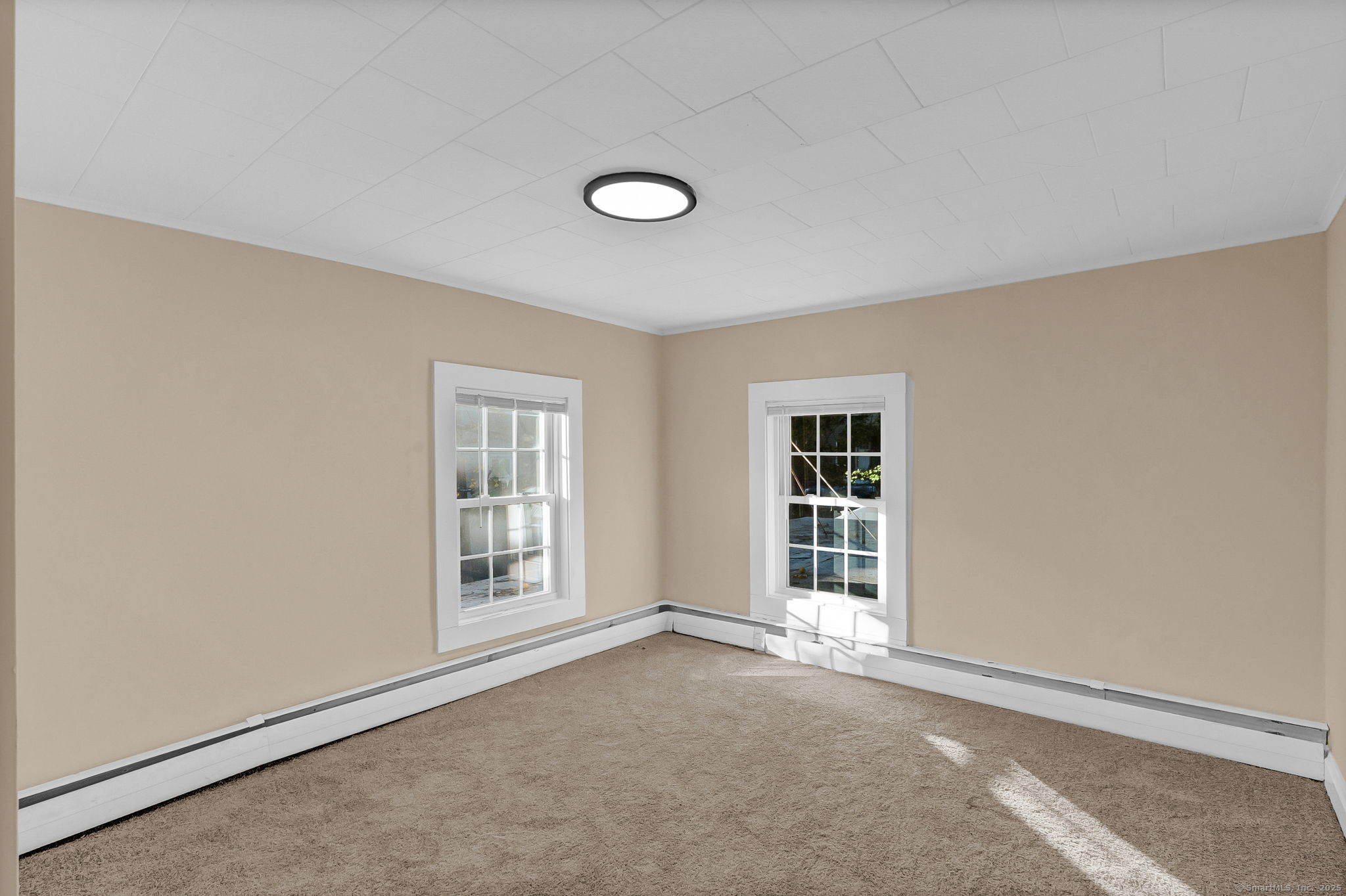 89 Spring Street Windham, CT 06226 - Photo 28 of 36 an empty room with windows