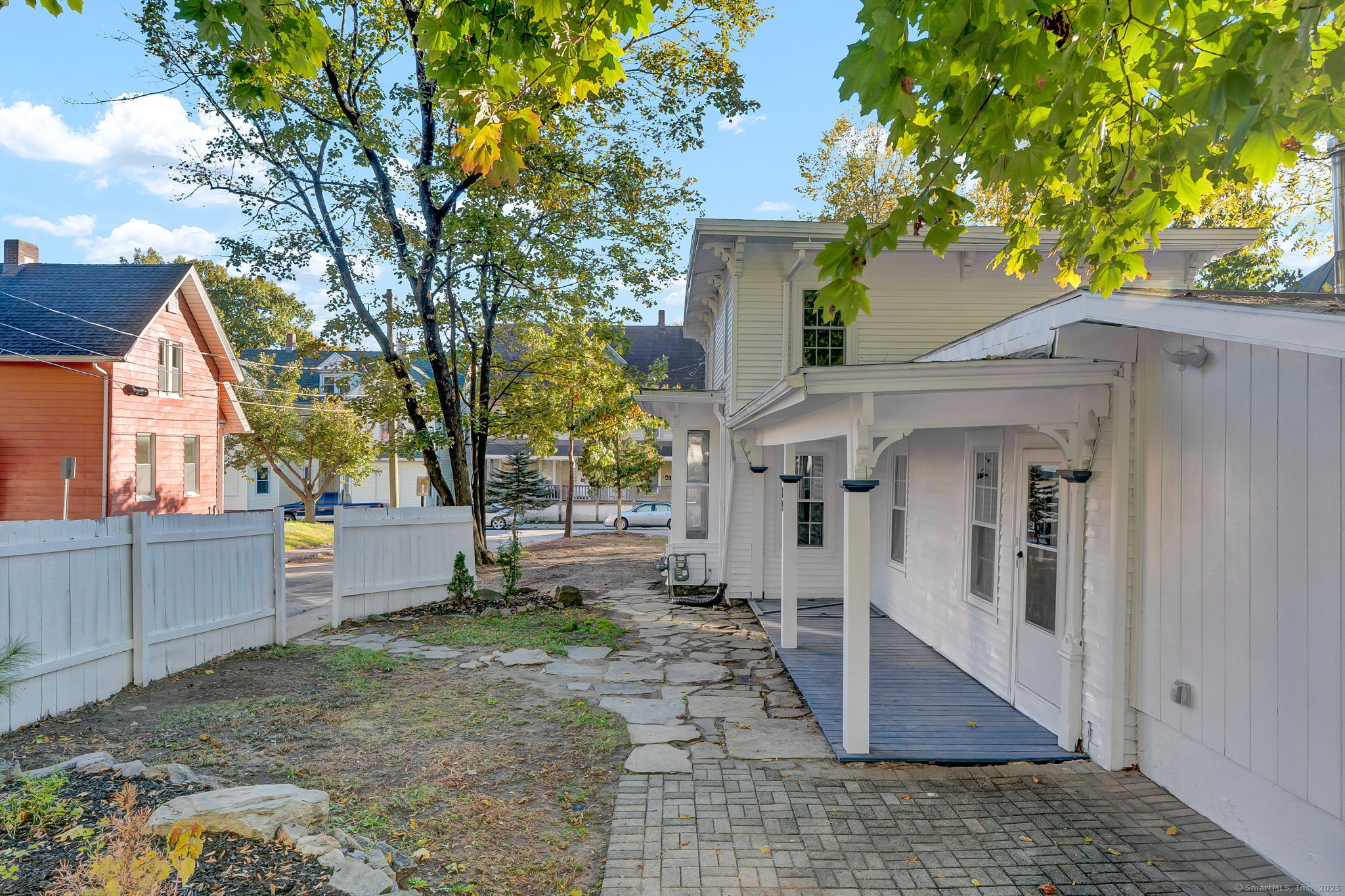 89 Spring Street Windham, CT 06226 - Photo 4 of 36 a view of a house with a yard
