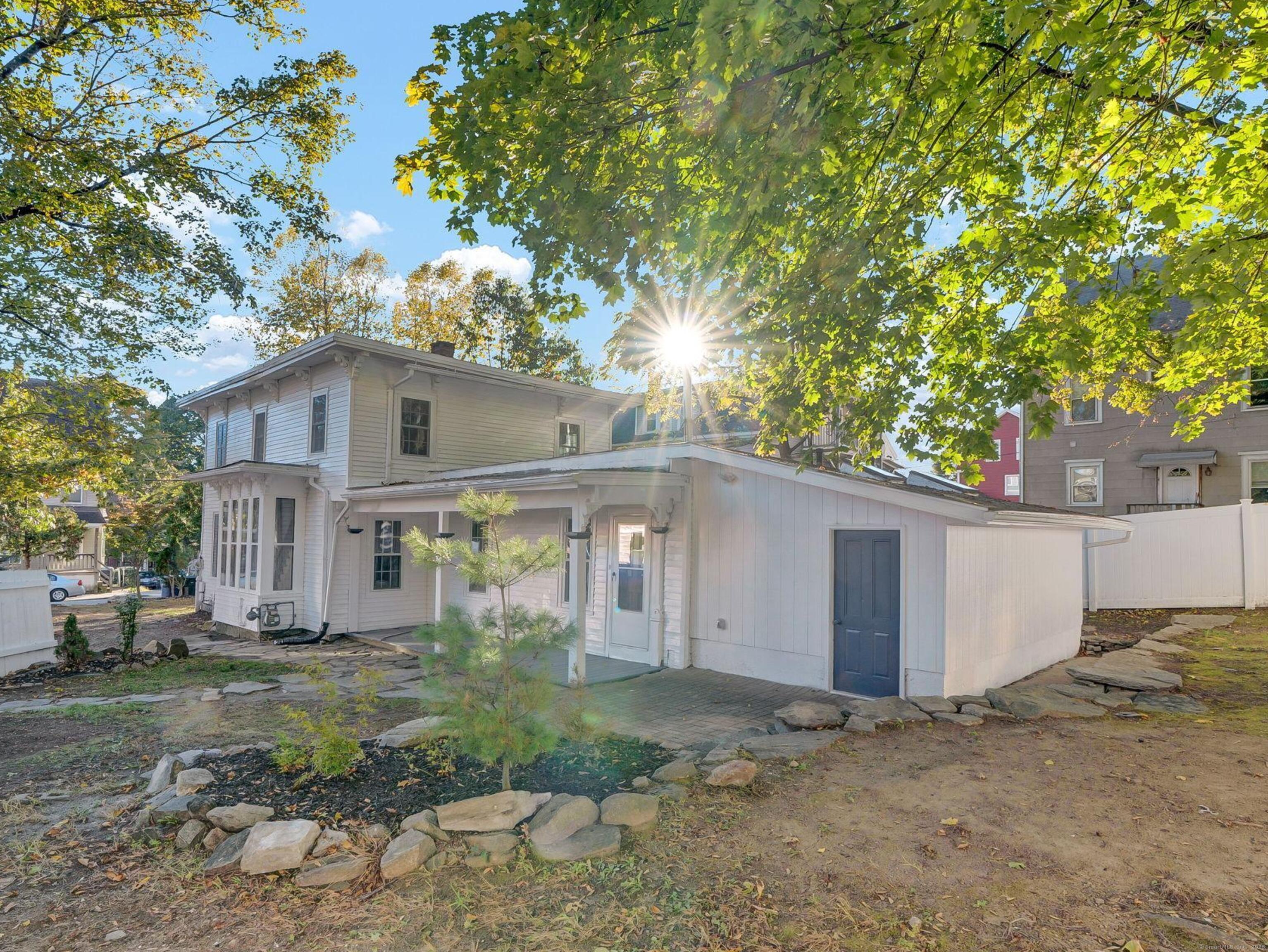 89 Spring Street Windham, CT 06226 - Photo 6 of 36 a view of a house with a yard