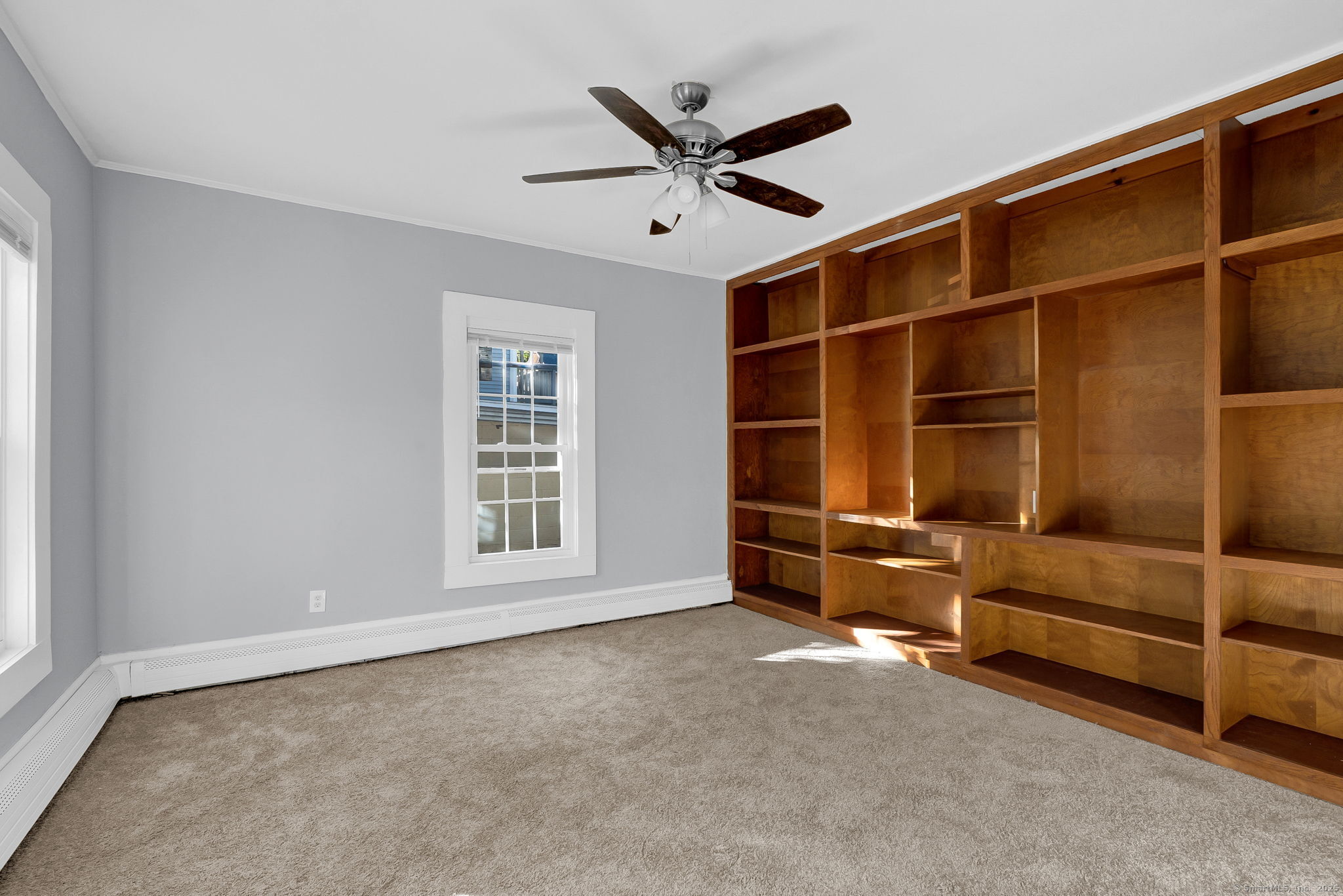 89 Spring Street Windham, CT 06226 - Photo 7 of 36 a view of an empty room with a ceiling fan