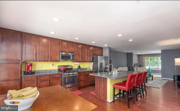 a kitchen with a dining table chairs and utility room