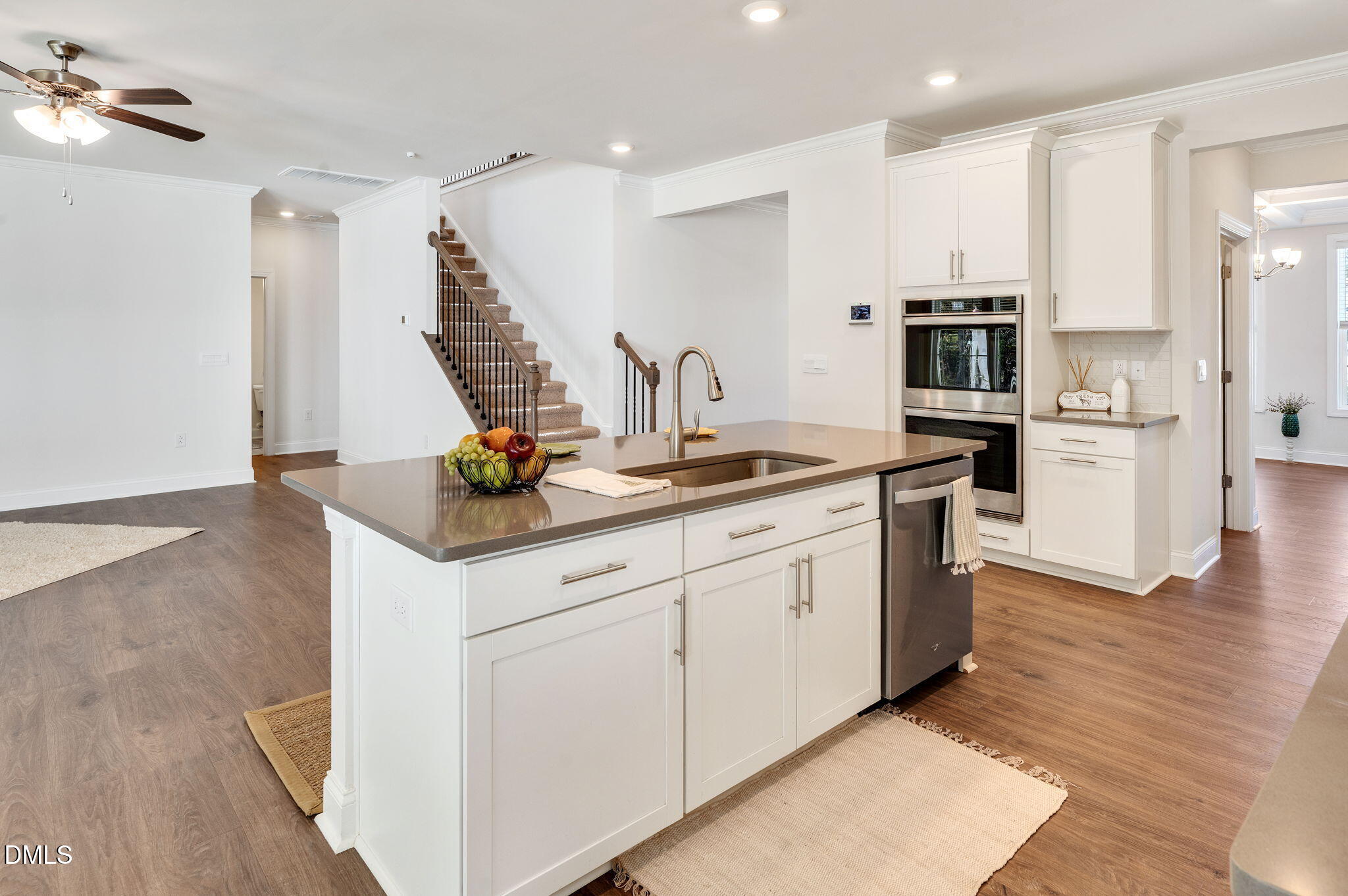 5112 Lizard Tail Lane Raleigh, NC 27603 - Photo 16 of 51 a kitchen with white cabinets and appliances