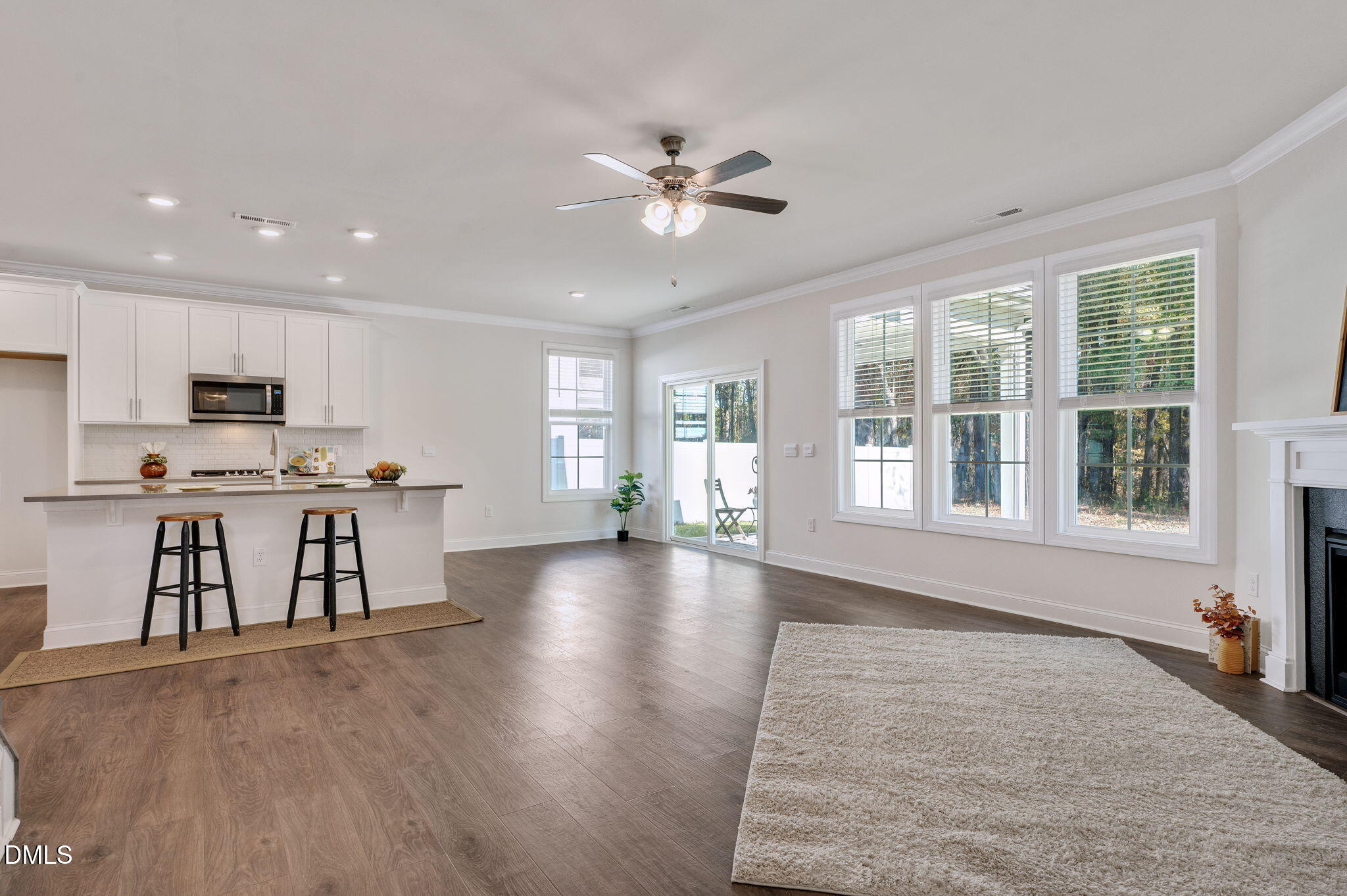 5112 Lizard Tail Lane Raleigh, NC 27603 - Photo 18 of 51 a view of an empty room with kitchen and window