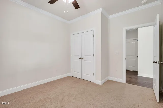 an empty room with closet area