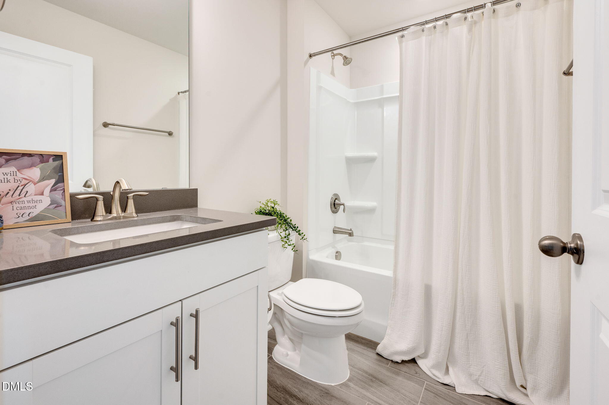 5112 Lizard Tail Lane Raleigh, NC 27603 - Photo 26 of 51 a bathroom with a sink a toilet and shower