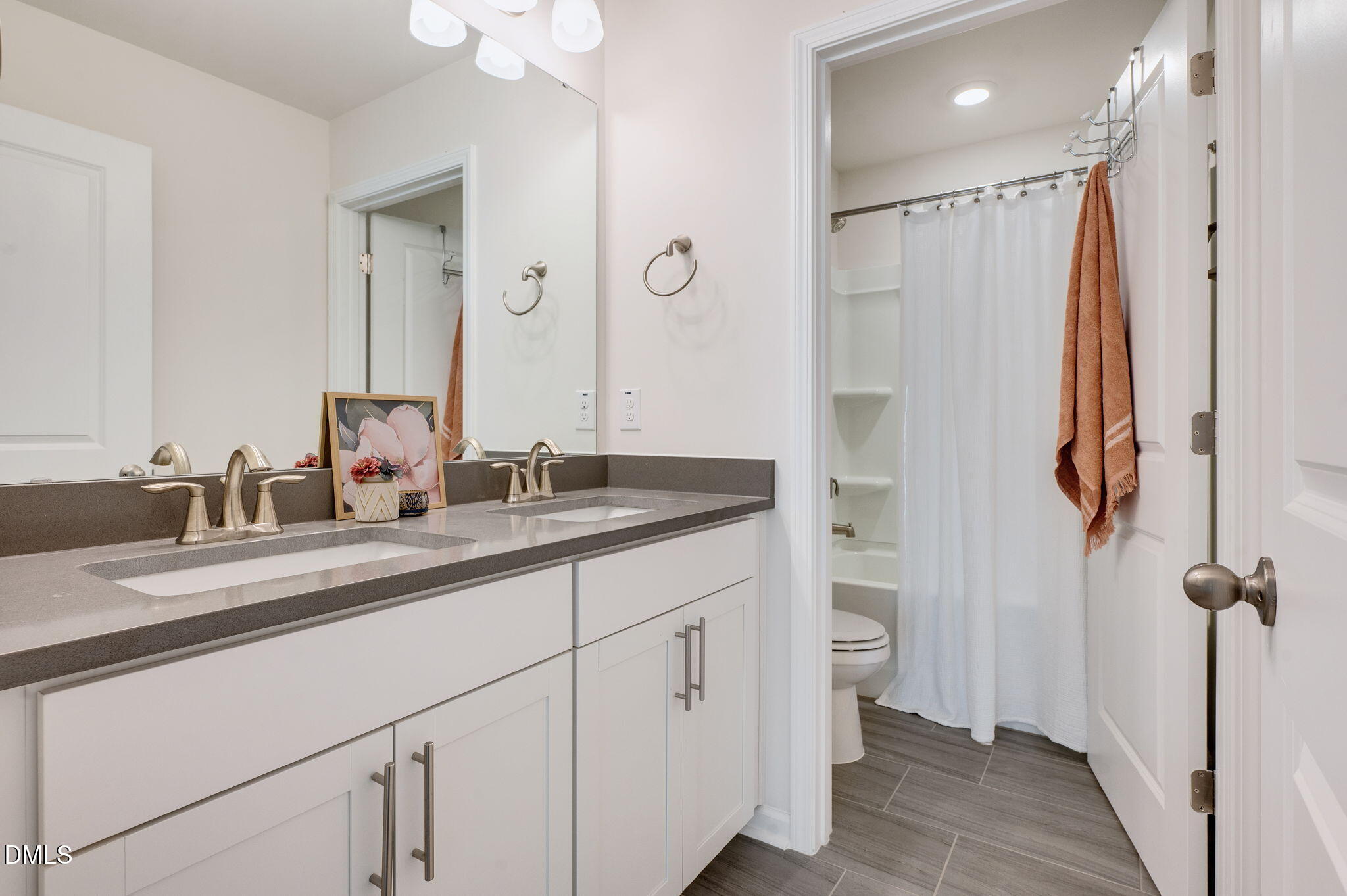 5112 Lizard Tail Lane Raleigh, NC 27603 - Photo 29 of 51 a bathroom with a double vanity sink mirror and shower