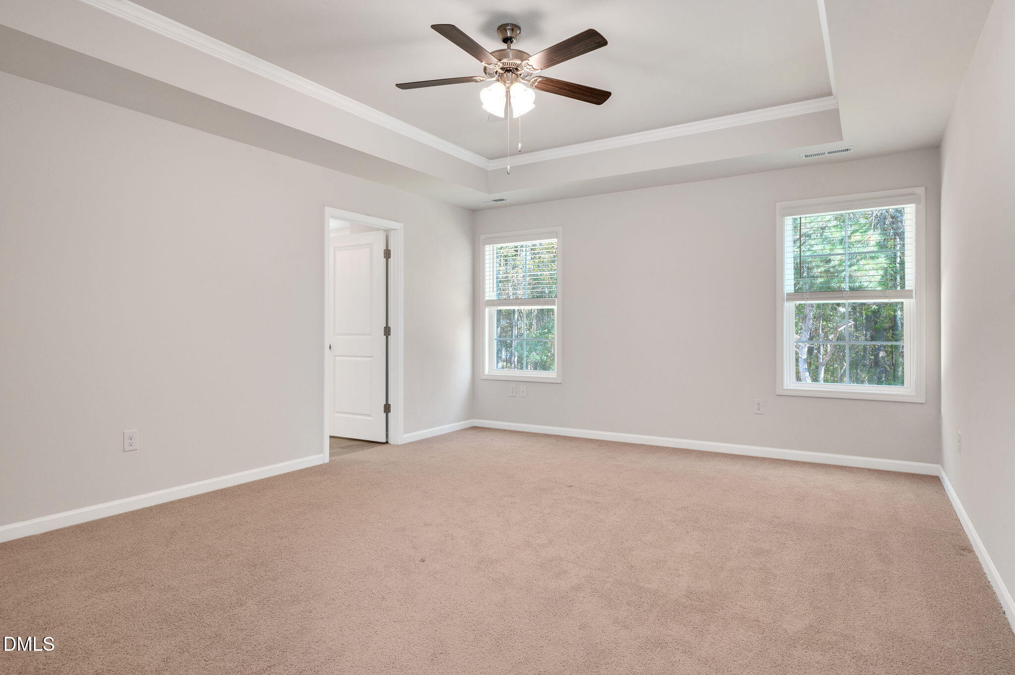 5112 Lizard Tail Lane Raleigh, NC 27603 - Photo 32 of 51 an empty room with windows and ceiling fan
