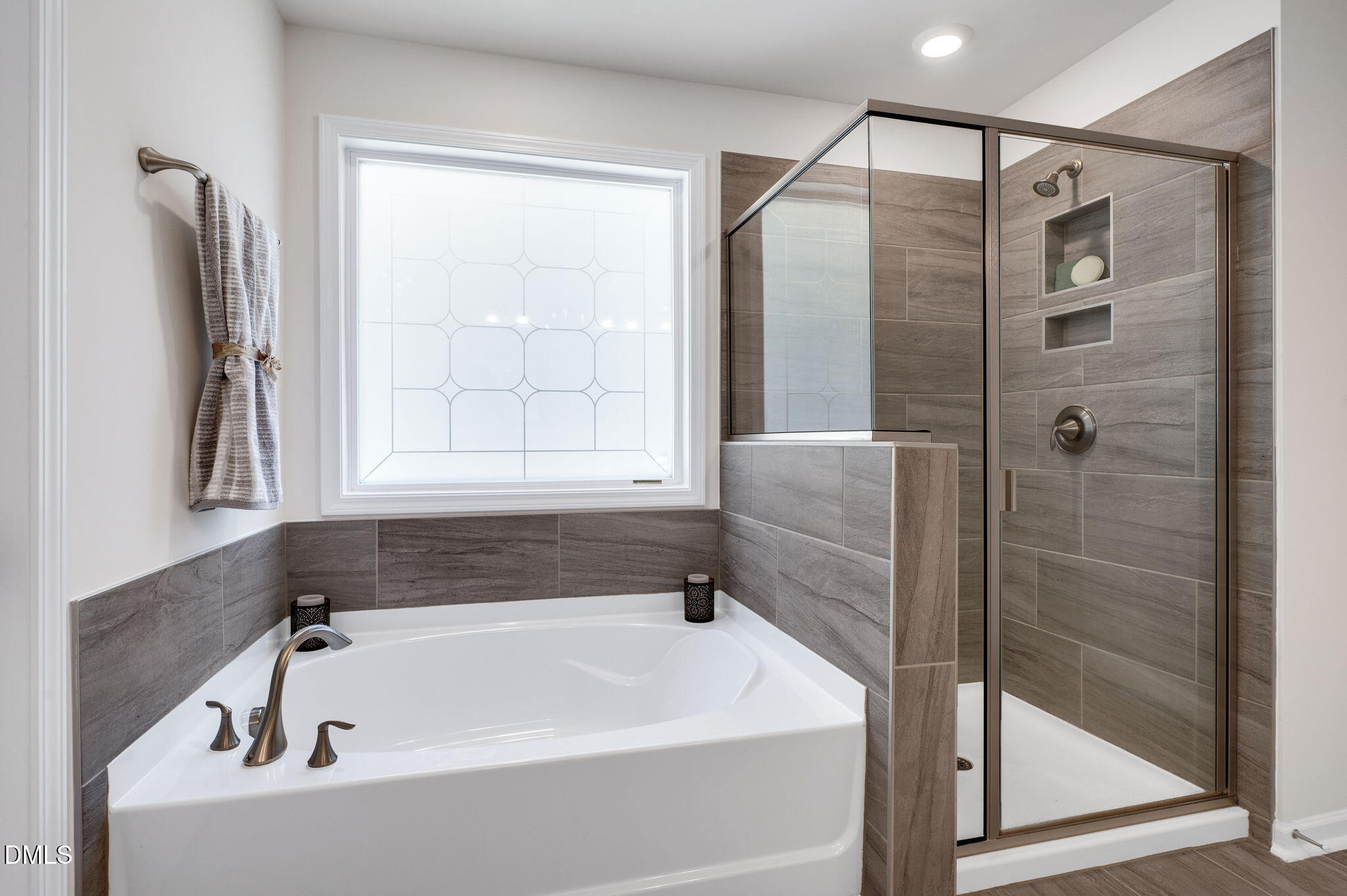 5112 Lizard Tail Lane Raleigh, NC 27603 - Photo 34 of 51 a white bath tub sitting next to a shower