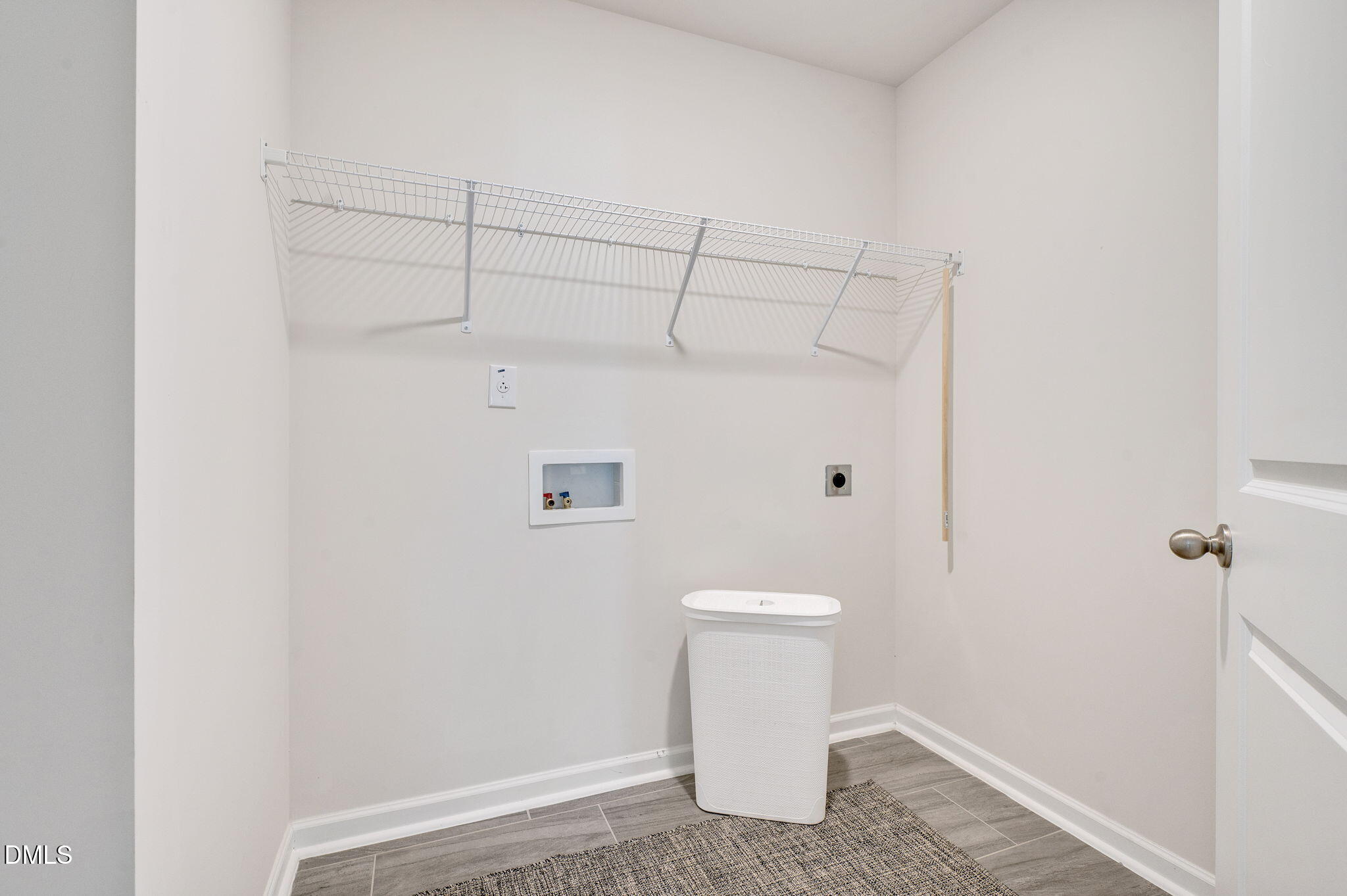 5112 Lizard Tail Lane Raleigh, NC 27603 - Photo 35 of 51 a white toilet sitting next to a white cabinet