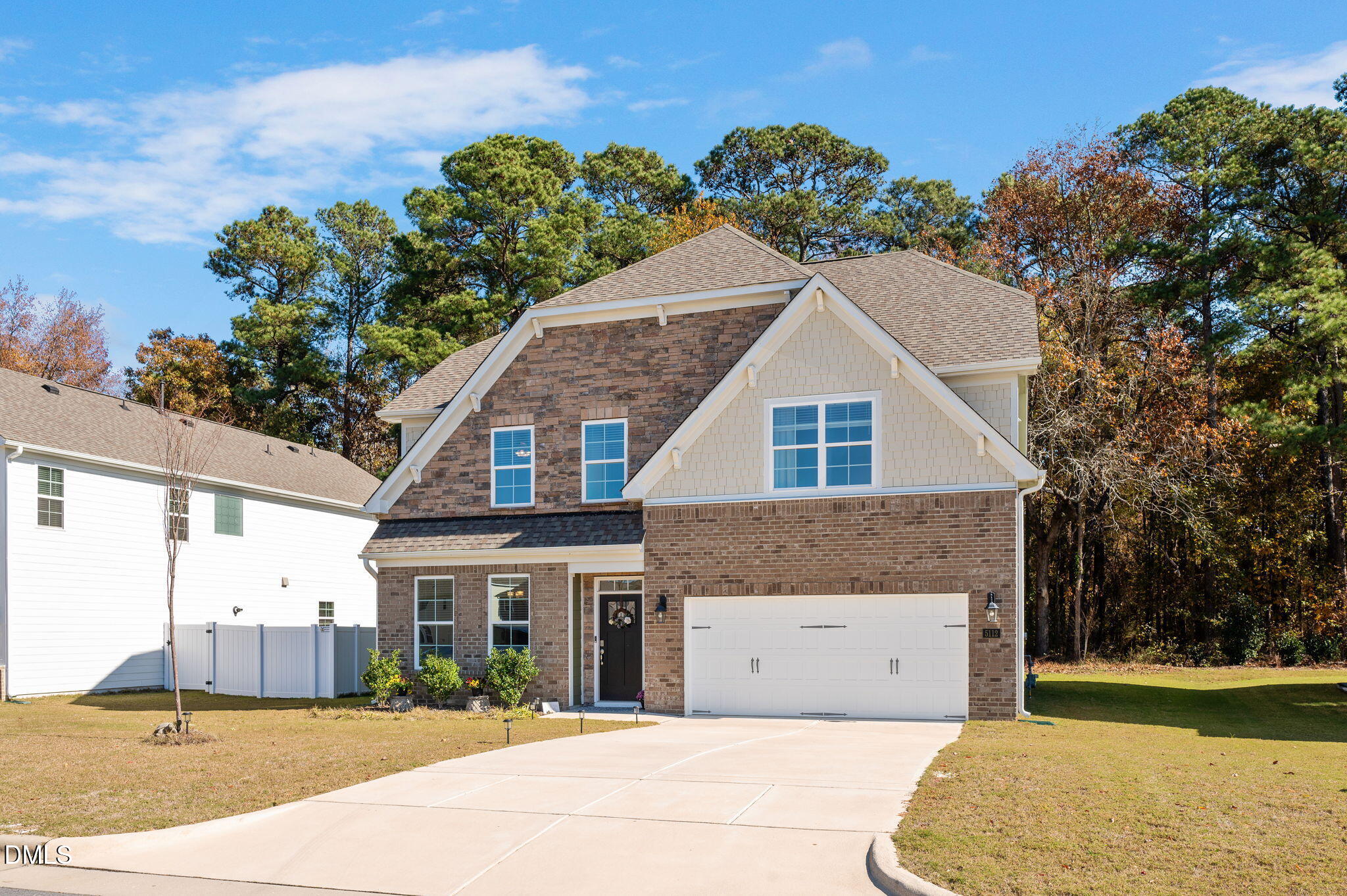 5112 Lizard Tail Lane Raleigh, NC 27603 - Photo 3 of 51 a view of a white house with a yard