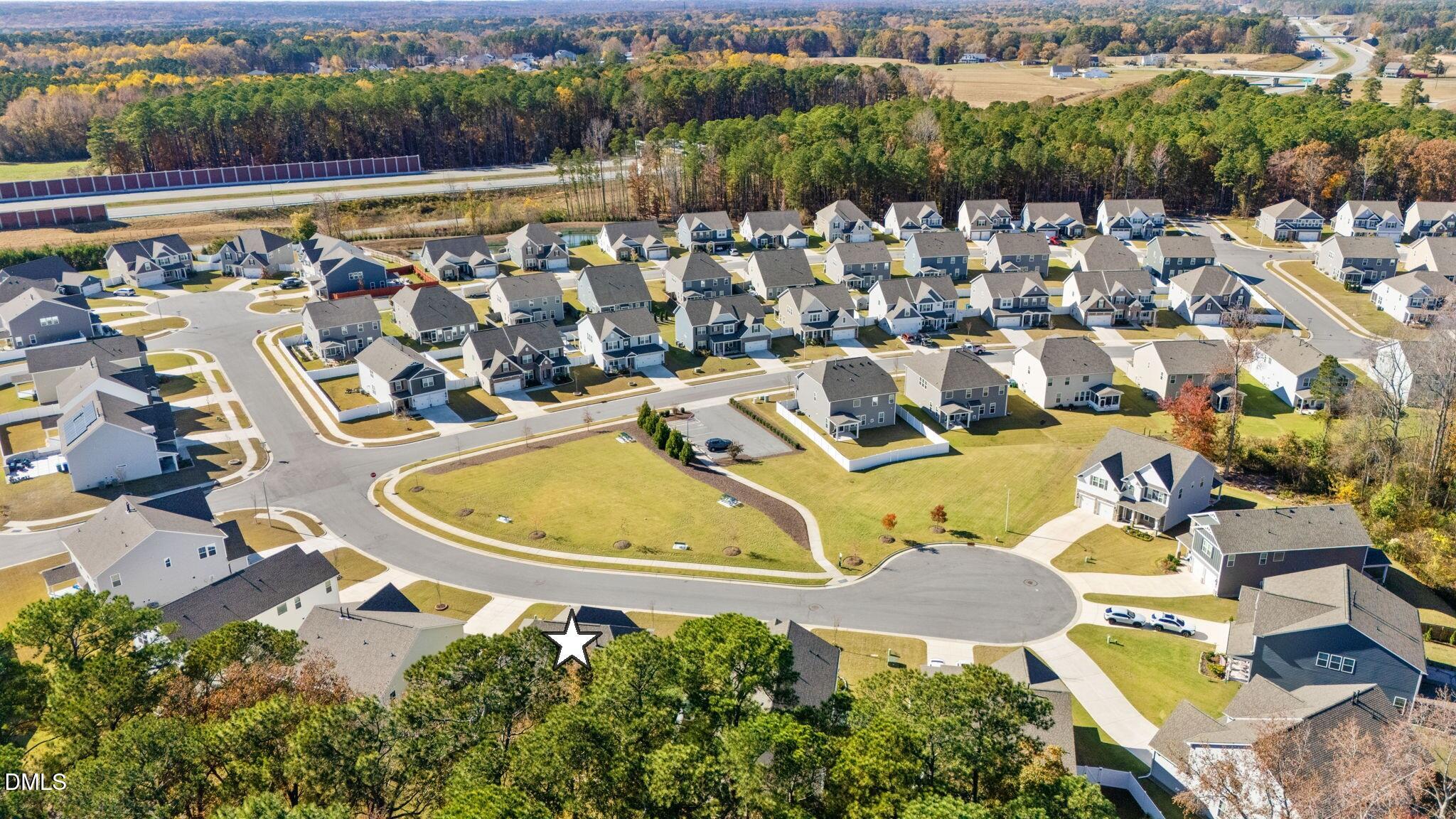 5112 Lizard Tail Lane Raleigh, NC 27603 - Photo 48 of 51 an aerial view of a house with a lake view