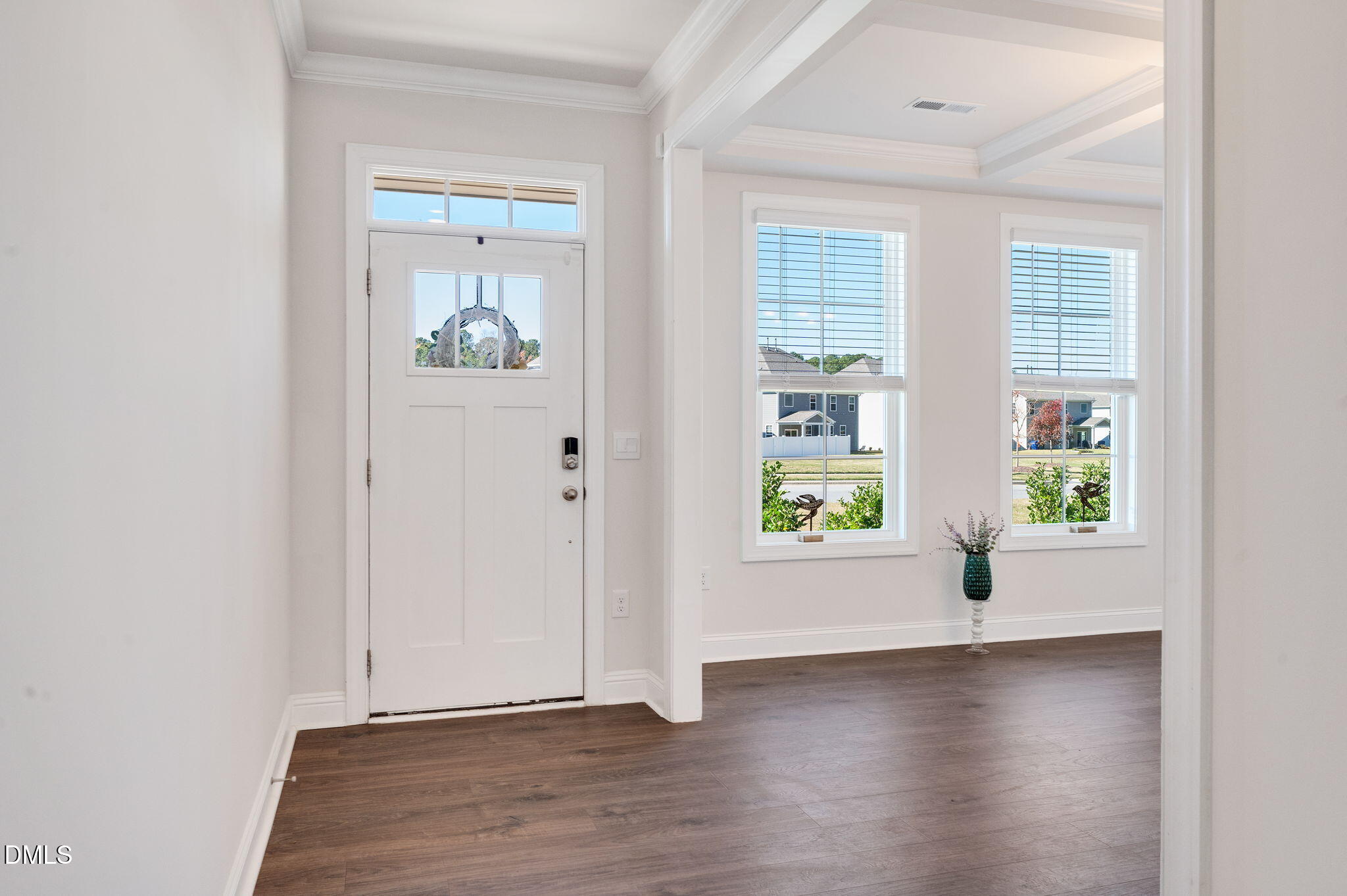 5112 Lizard Tail Lane Raleigh, NC 27603 - Photo 6 of 51 an empty room with wooden floor and windows