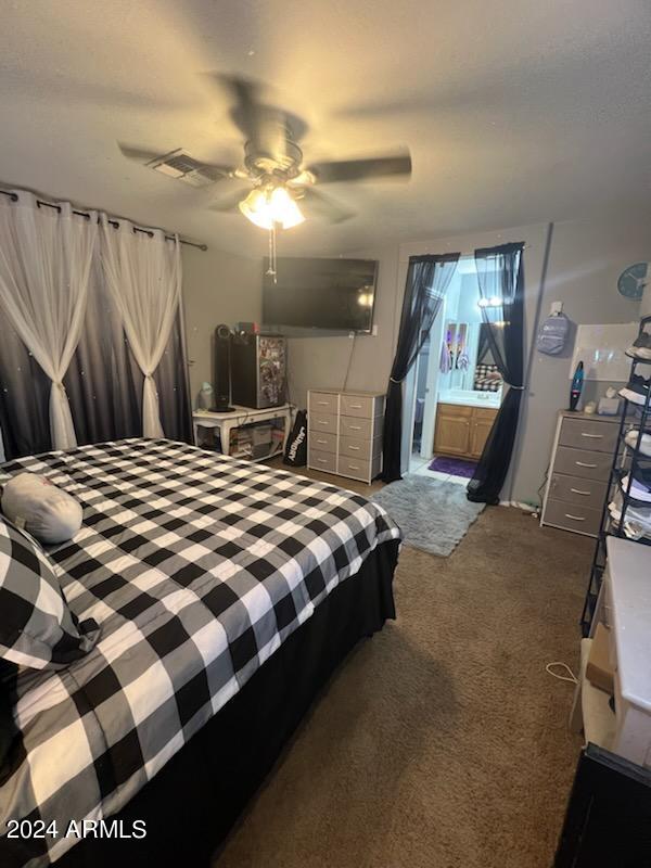 11962 West Coronado Road Avondale, AZ 85392 - Photo 14 of 23 a bedroom with a bed and walk in closet
