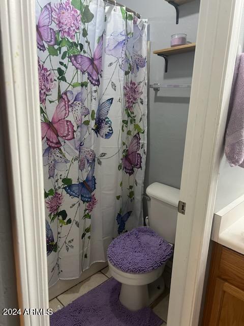 11962 West Coronado Road Avondale, AZ 85392 - Photo 15 of 23 a bathroom with a sink toilet and shower