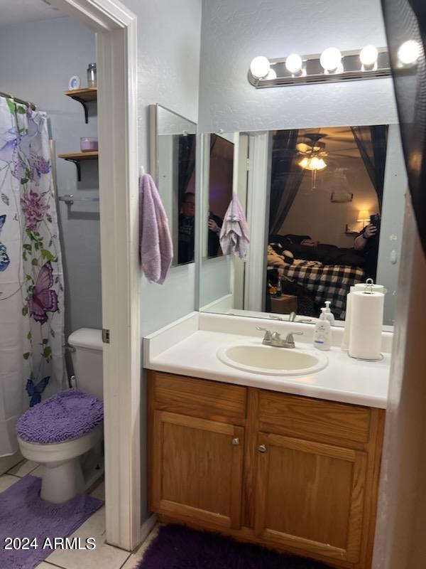11962 West Coronado Road Avondale, AZ 85392 - Photo 16 of 23 a bathroom with a sink vanity and toilet