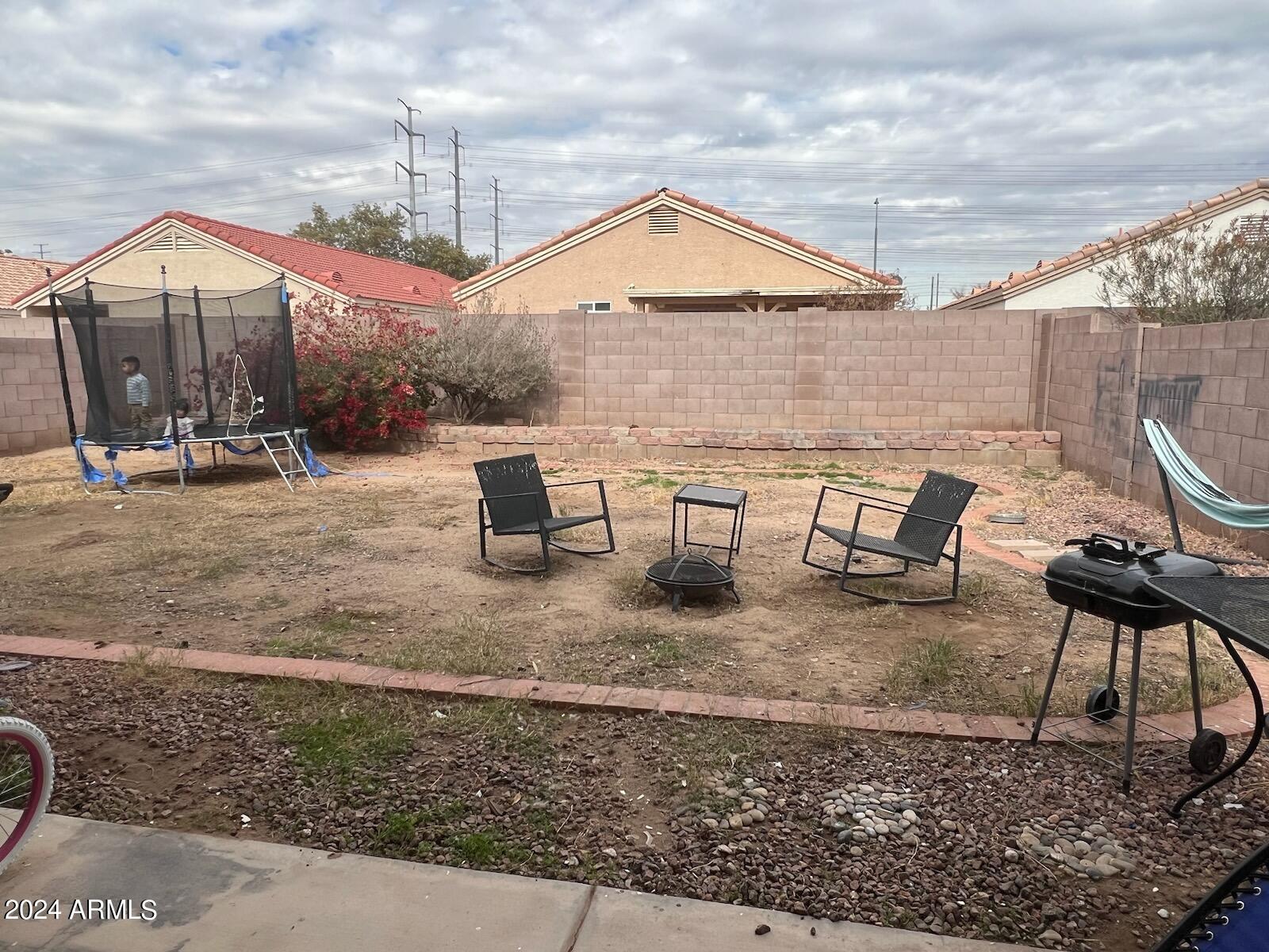 11962 West Coronado Road Avondale, AZ 85392 - Photo 21 of 23 a view of a house with backyard porch and sitting area