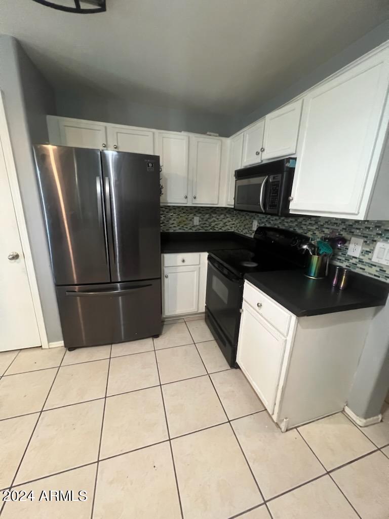 11962 West Coronado Road Avondale, AZ 85392 - Photo 5 of 23 a kitchen with stainless steel appliances a refrigerator sink and stove