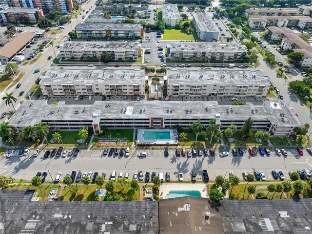a living room with a table and chairs