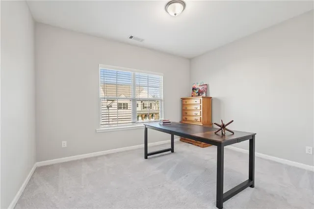 a room with a bed and window