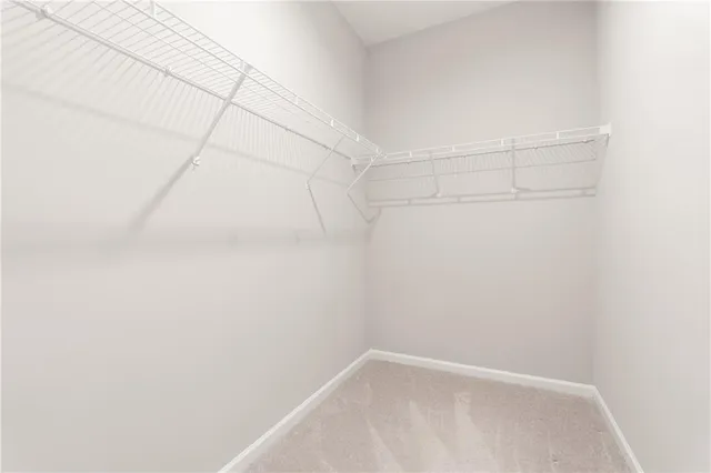 a bedroom with bed and window