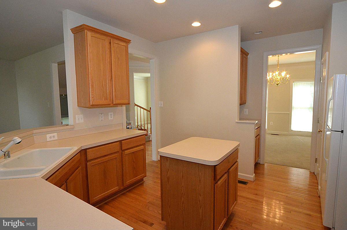 23506 Clarksburg Road Clarksburg, MD 20871 - Photo 2 of 29 a bathroom with a sink a toilet and shower