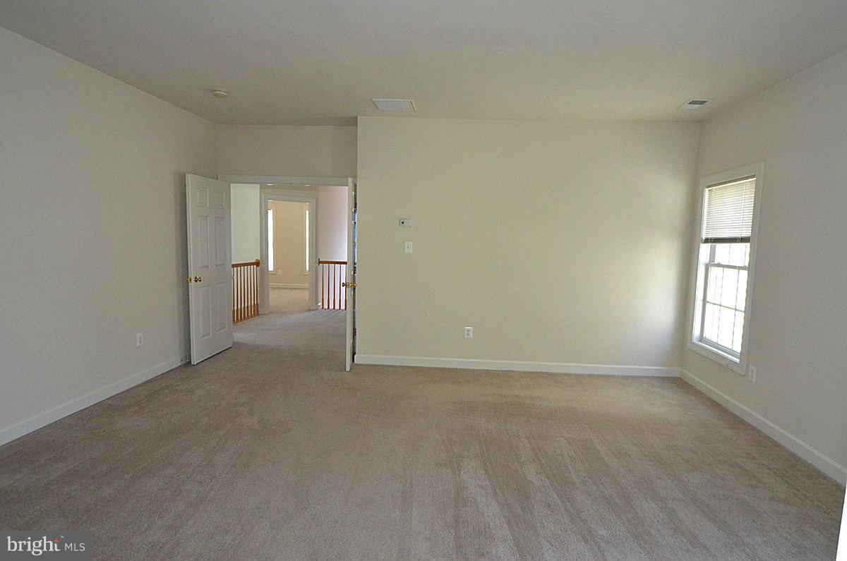 23506 Clarksburg Road Clarksburg, MD 20871 - Photo 15 of 29 an empty room with windows and closet