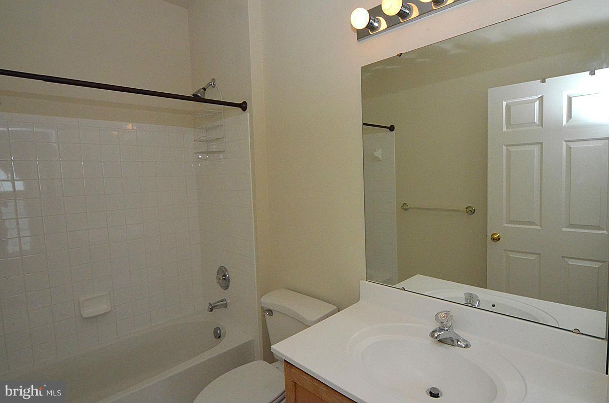 23506 Clarksburg Road Clarksburg, MD 20871 - Photo 23 of 29 a bathroom with a bathtub and a sink