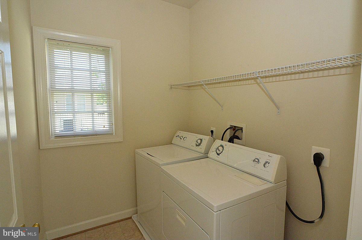 23506 Clarksburg Road Clarksburg, MD 20871 - Photo 25 of 29 a utility room with dryer and washer