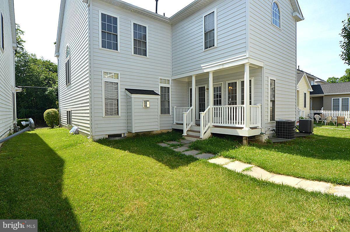 23506 Clarksburg Road Clarksburg, MD 20871 - Photo 27 of 29 a front view of a house with a yard