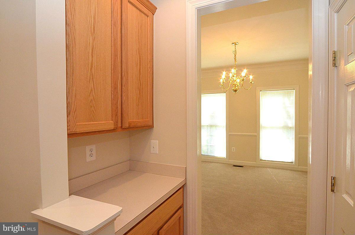 23506 Clarksburg Road Clarksburg, MD 20871 - Photo 5 of 29 a bathroom with a sink and a mirror