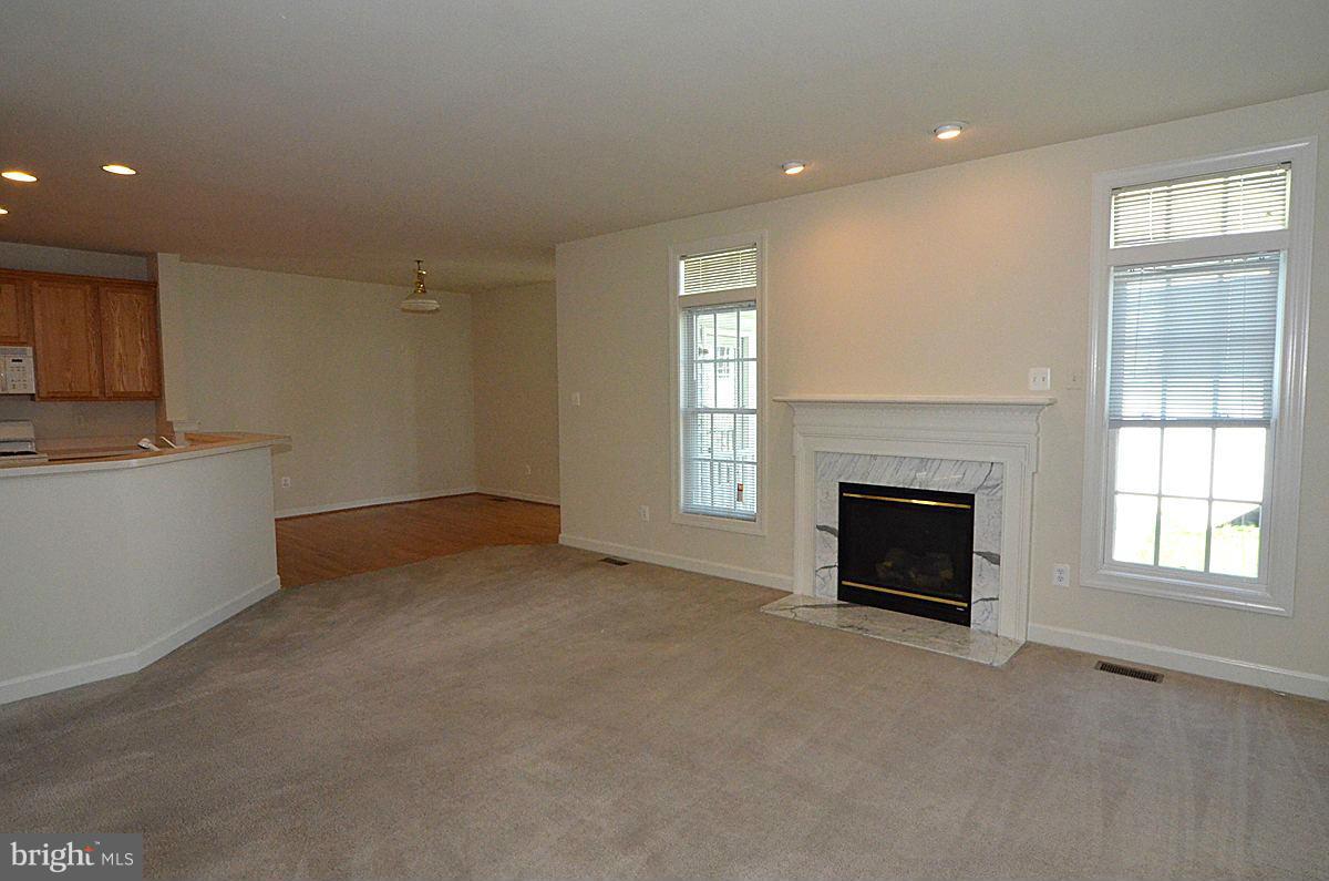 23506 Clarksburg Road Clarksburg, MD 20871 - Photo 7 of 29 a view of empty room with a fireplace and window