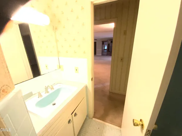 a bathroom with a tub and sink