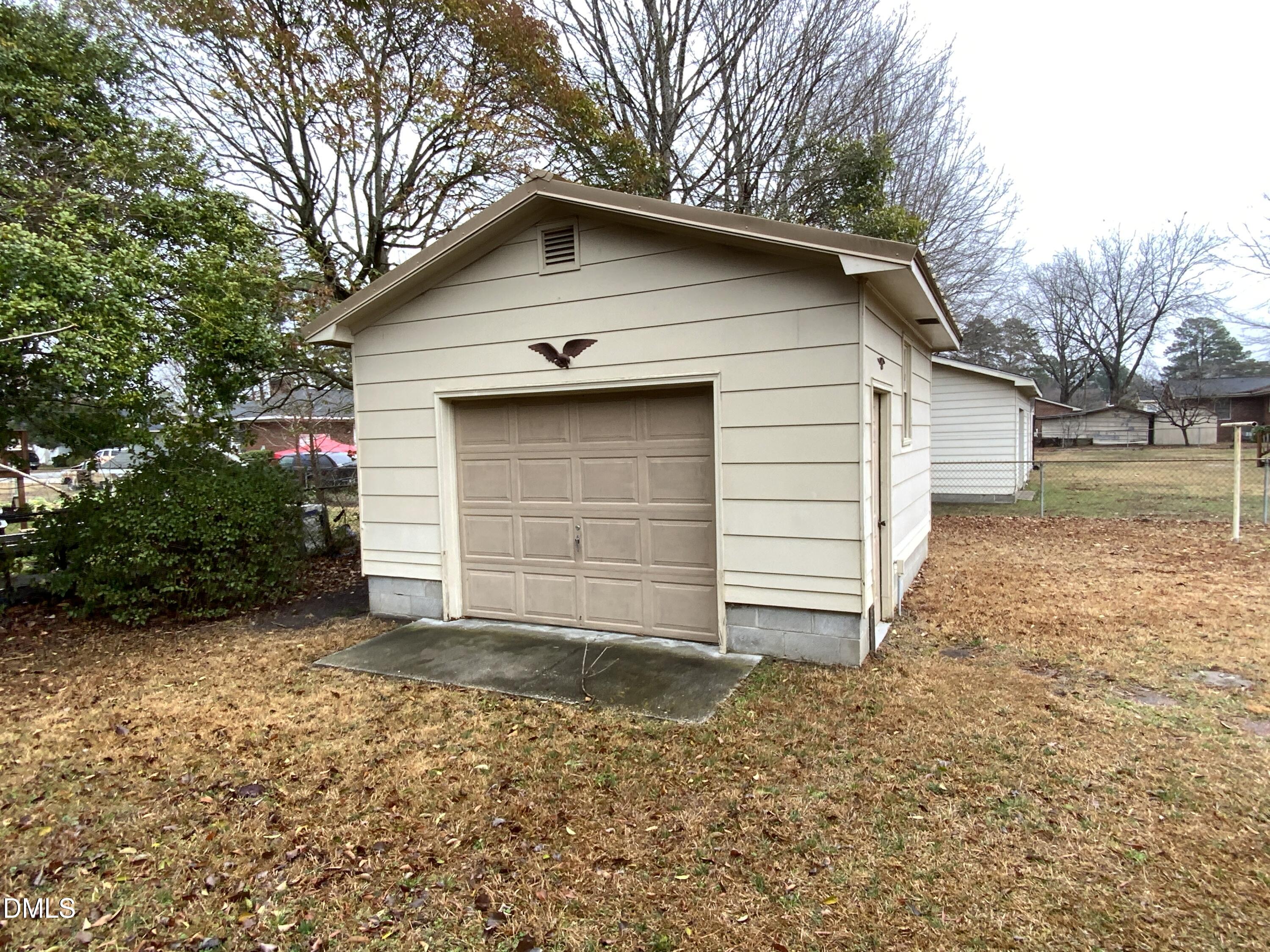 100 East C Street Erwin, NC 28339 - Photo 19 of 21 a house with a yard