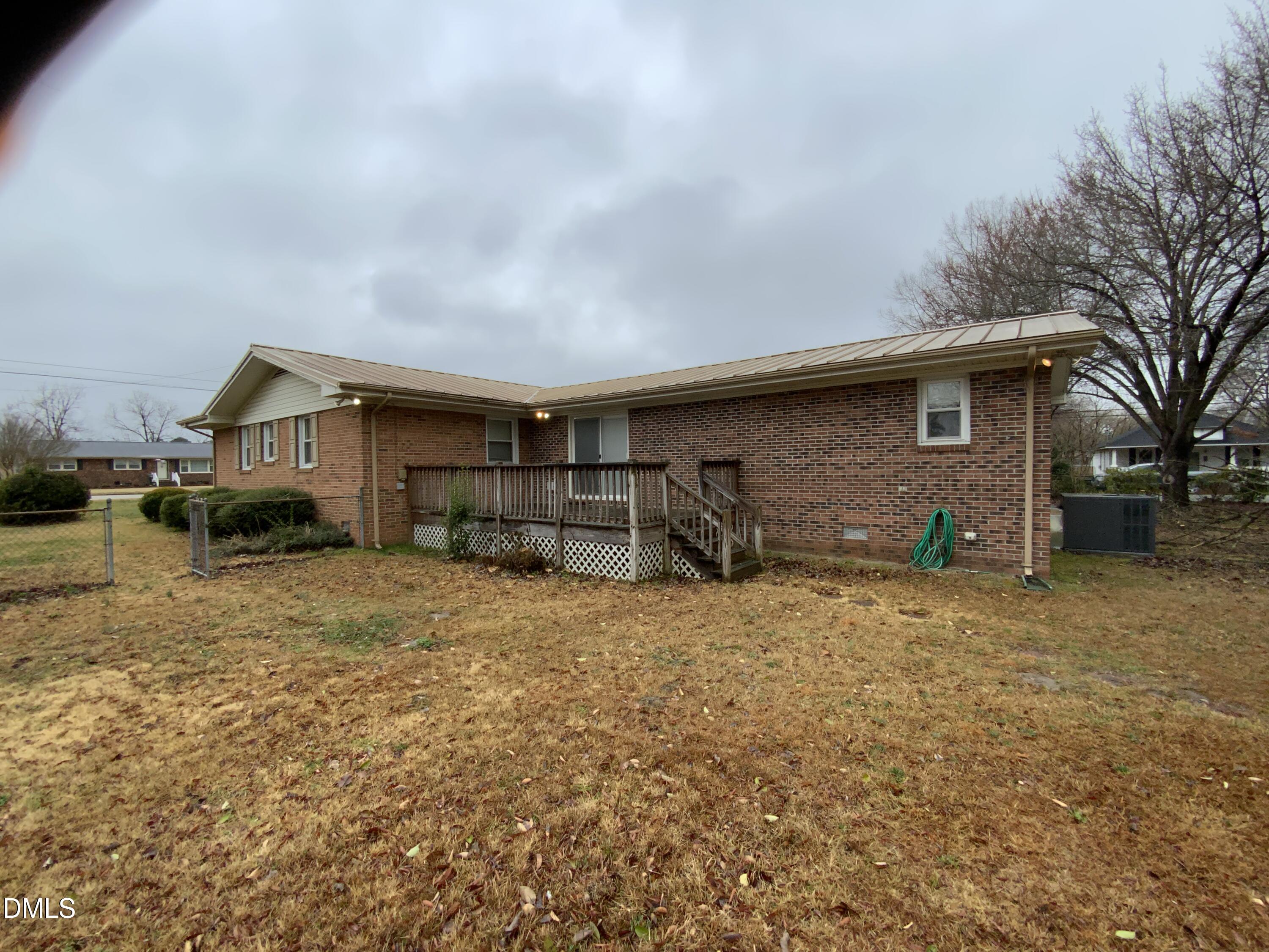 100 East C Street Erwin, NC 28339 - Photo 20 of 21 a house view with a backyard space