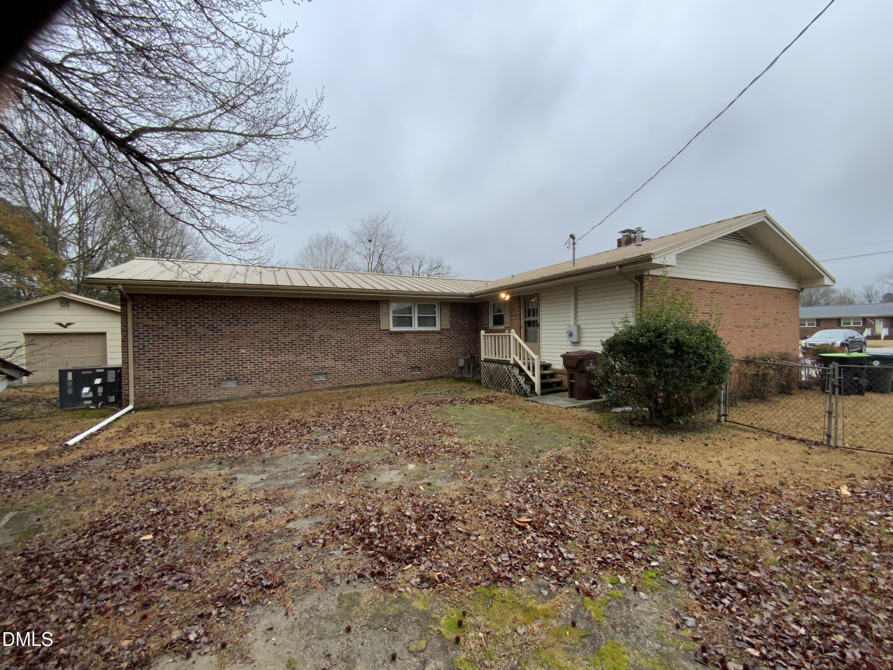 100 East C Street Erwin, NC 28339 - Photo 21 of 21 a view of a house with a yard