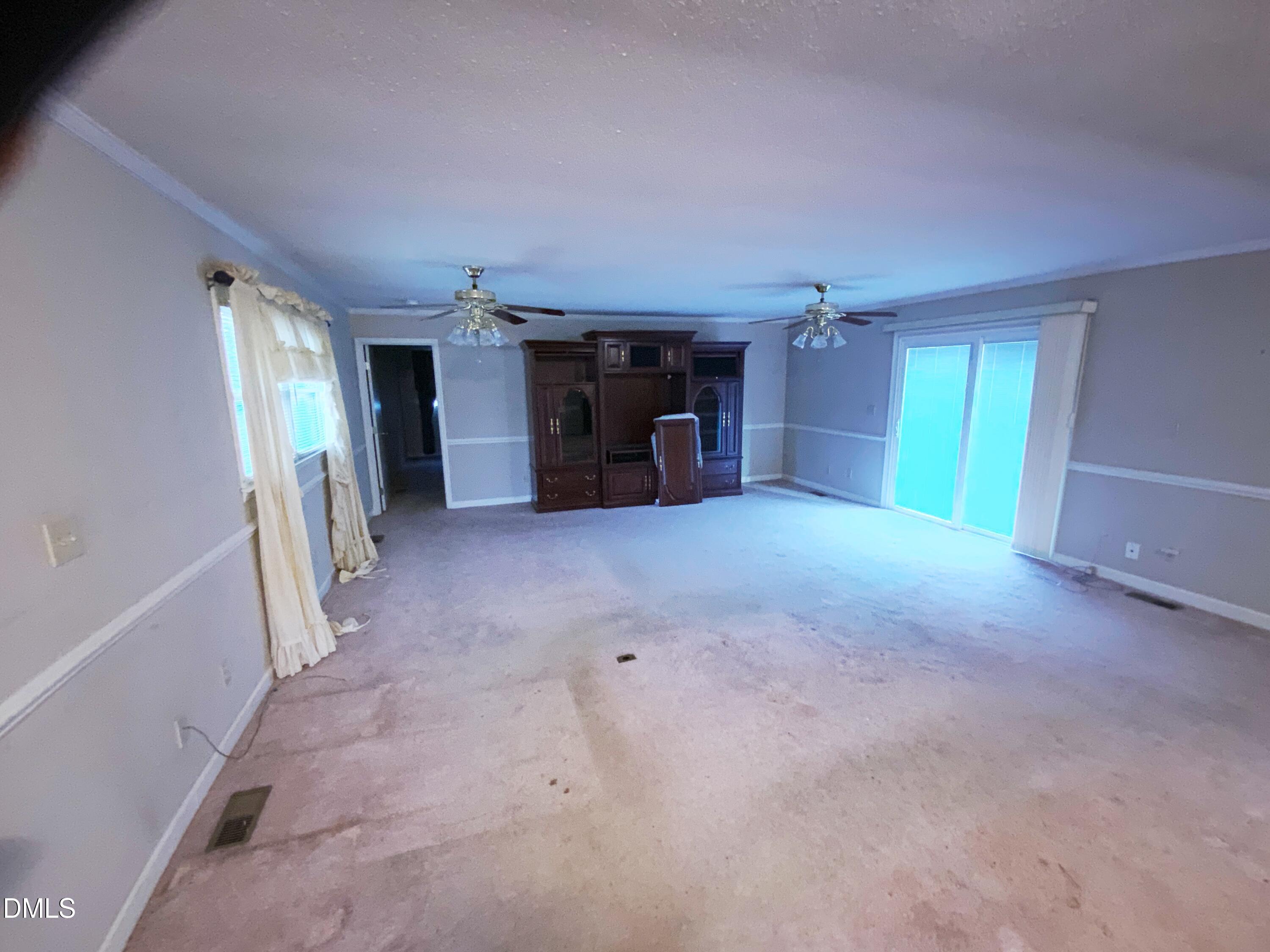 100 East C Street Erwin, NC 28339 - Photo 5 of 21 a view of empty room with furniture and a window