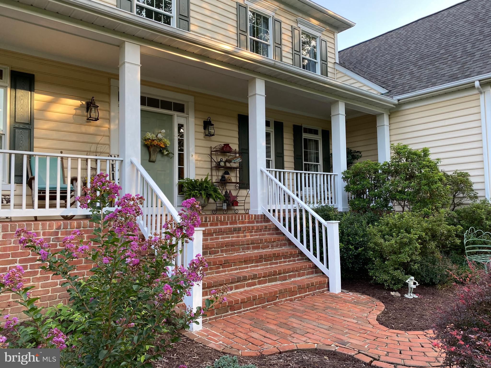 The covered brick front porch welcomes you home!