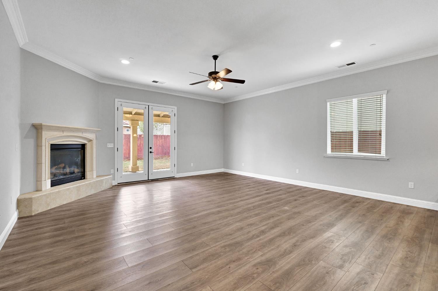 798 South Michelle Avenue Kerman, CA 93630 - Photo 5 of 33 Livingroom with fireplace and french doors