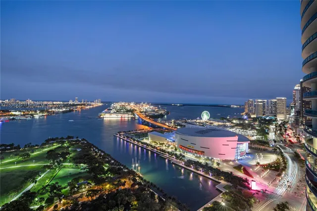 a bedroom with a large bed and a couch