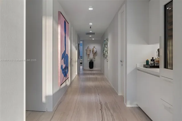 a bathroom with a granite countertop sink mirror vanity and toilet