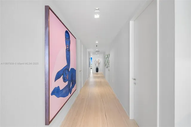 a bathroom with a granite countertop toilet sink and mirror