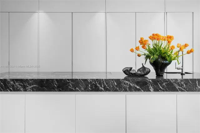 a bedroom with a large bed and a large window