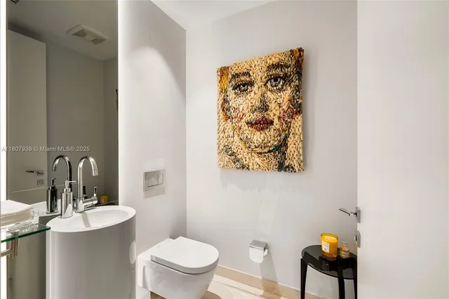 a bathroom with a sink a mirror and a shower